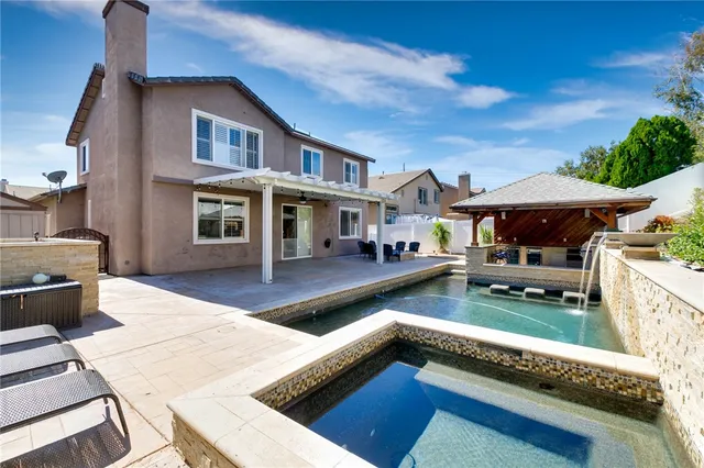a front view of house with yard outdoor seating and barbeque oven