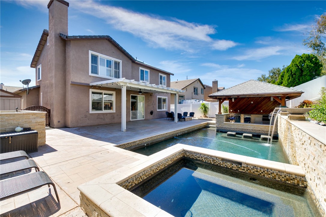 12206 Tunbridge Court Rancho Cucamonga, CA 91739 - Photo 28 of 34 a front view of house with yard outdoor seating and barbeque oven
