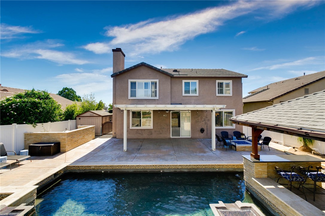 12206 Tunbridge Court Rancho Cucamonga, CA 91739 - Photo 29 of 34 a view of house with swimming pool outdoor seating