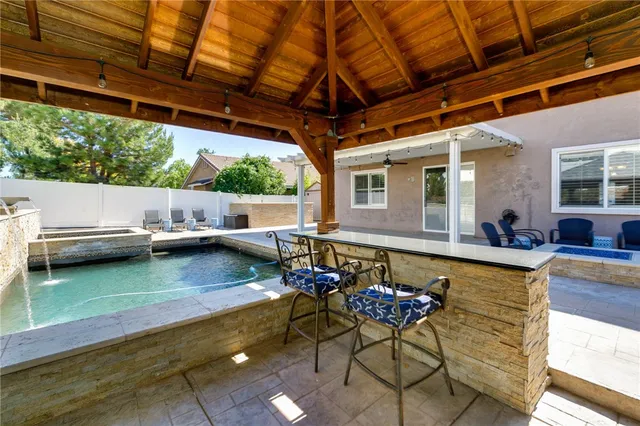 a view of a swimming pool with a patio