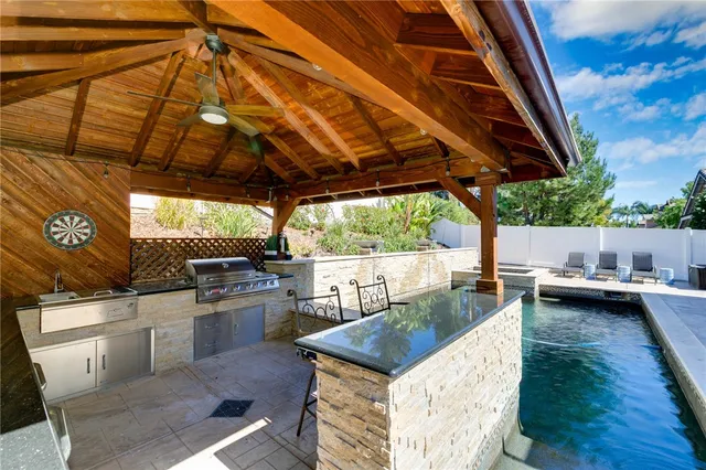 a kitchen view with a table and chairs