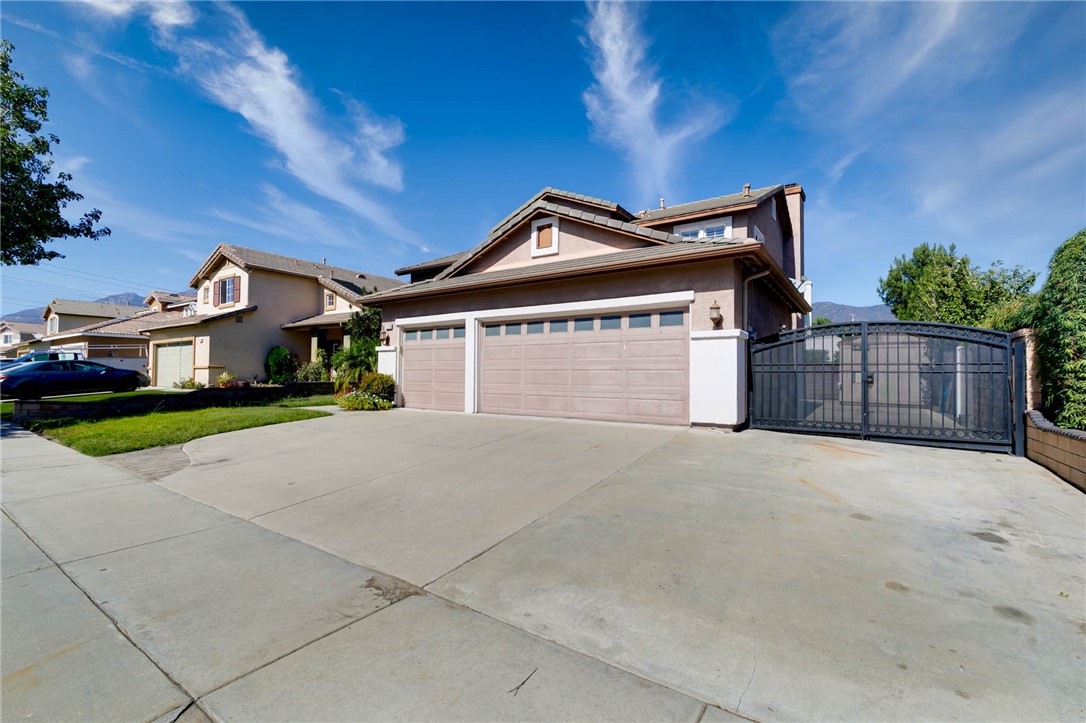 12206 Tunbridge Court Rancho Cucamonga, CA 91739 - Photo 34 of 34 a front view of a house with a yard and garage