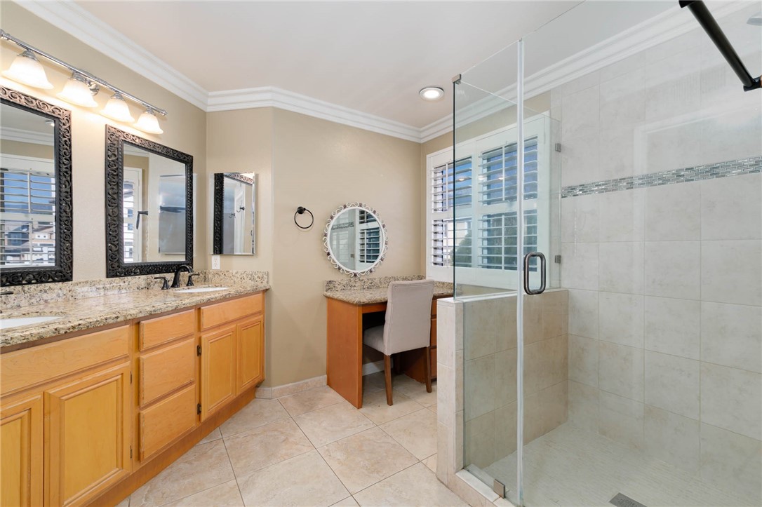 12206 Tunbridge Court Rancho Cucamonga, CA 91739 - Photo 5 of 34 a spacious bathroom with a sink and a mirror