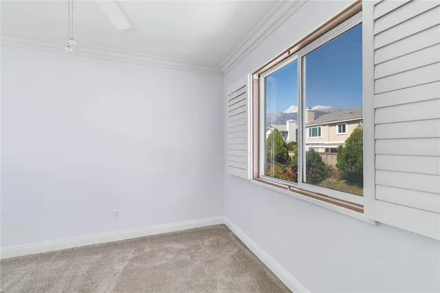 a view of an empty room with a window