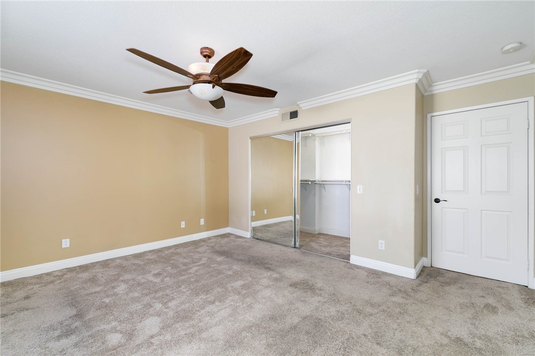 12206 Tunbridge Court Rancho Cucamonga, CA 91739 - Photo 9 of 34 a view of an empty room with a ceiling fan
