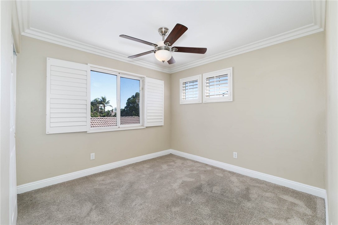 12206 Tunbridge Court Rancho Cucamonga, CA 91739 - Photo 10 of 34 an empty room with window and ceiling fan