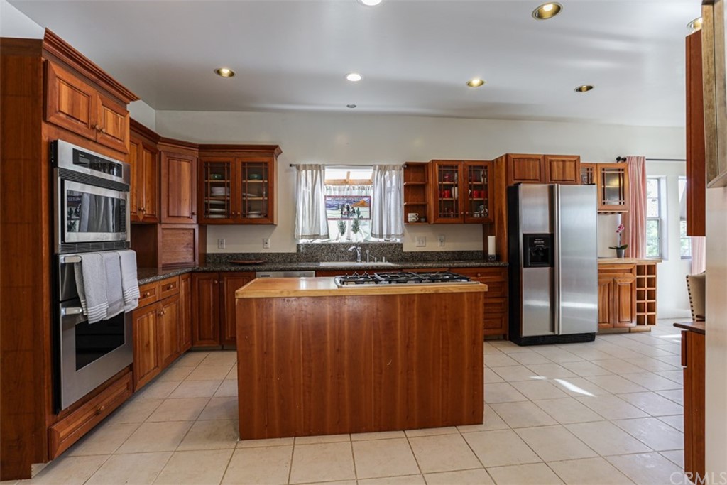 1608 Hill Drive Eagle Rock, CA 90041 - Photo 14 of 71 a kitchen with stainless steel appliances granite countertop a refrigerator and a stove