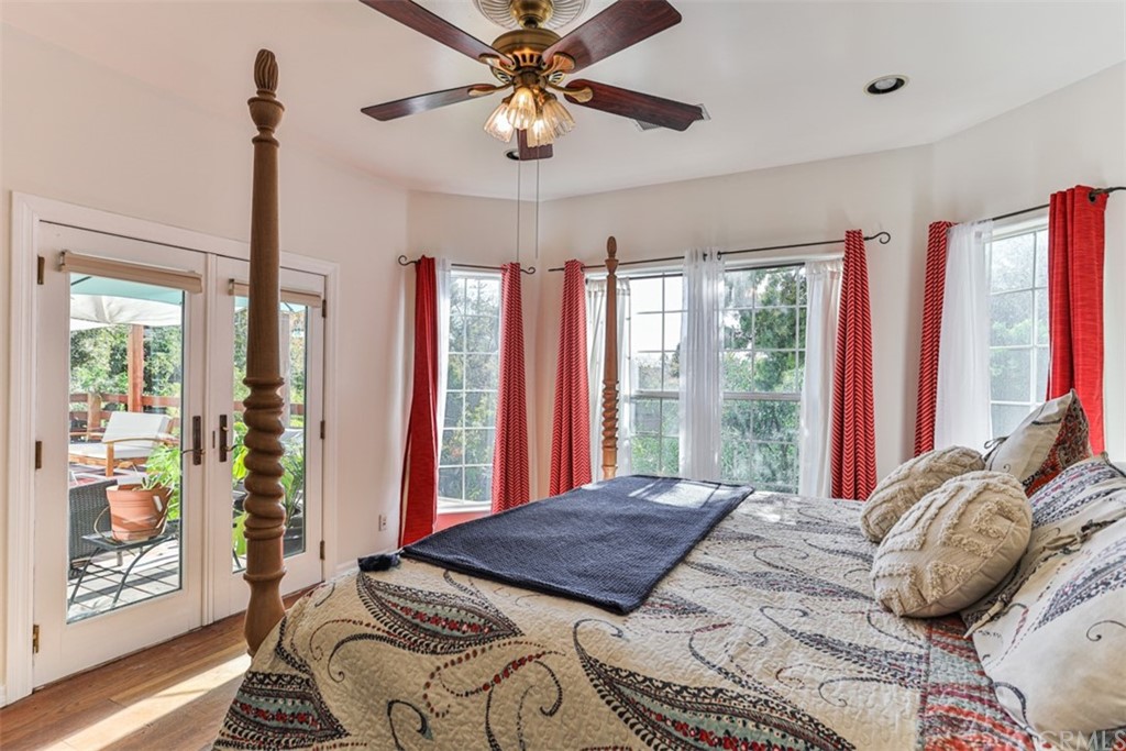 1608 Hill Drive Eagle Rock, CA 90041 - Photo 23 of 71 a bedroom with a large bed and a chandelier