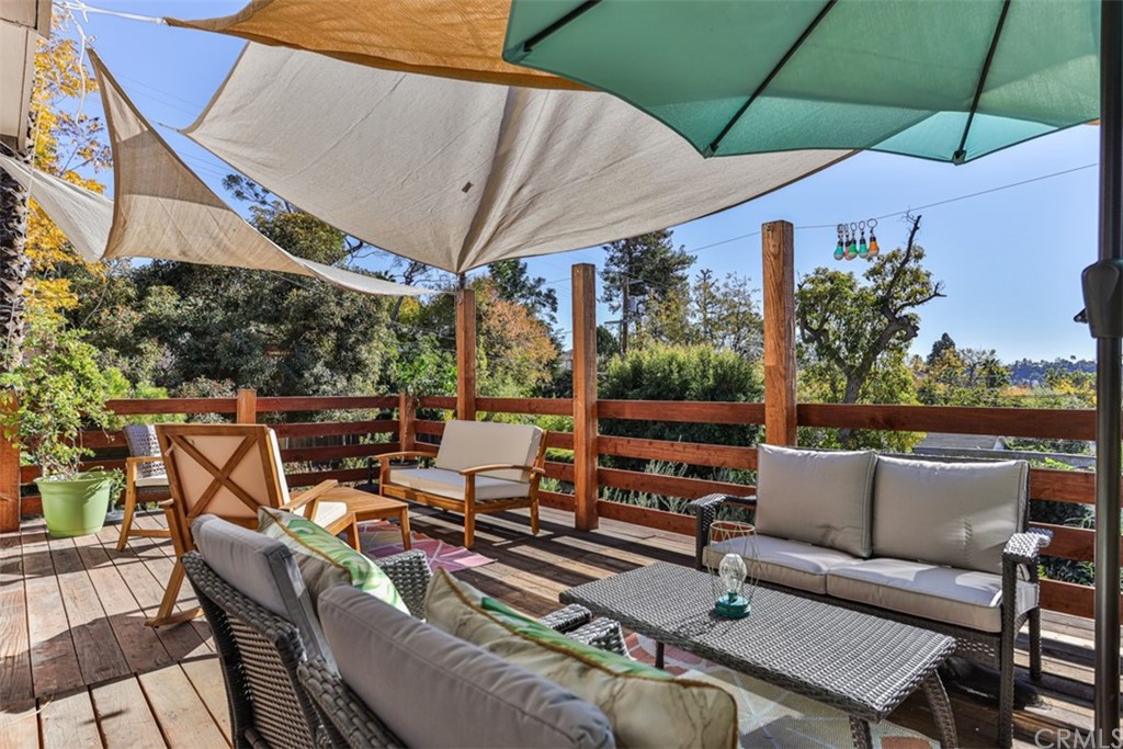 1608 Hill Drive Eagle Rock, CA 90041 - Photo 28 of 71 a patio with patio a table and chairs under an umbrella
