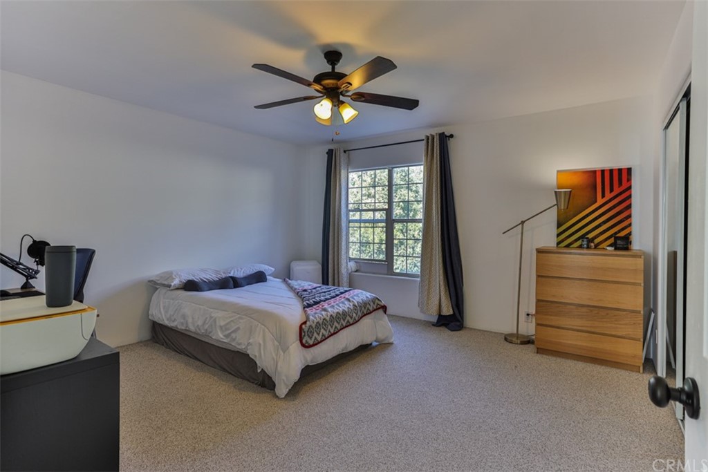 1608 Hill Drive Eagle Rock, CA 90041 - Photo 36 of 71 a bedroom with a bed and a chandelier