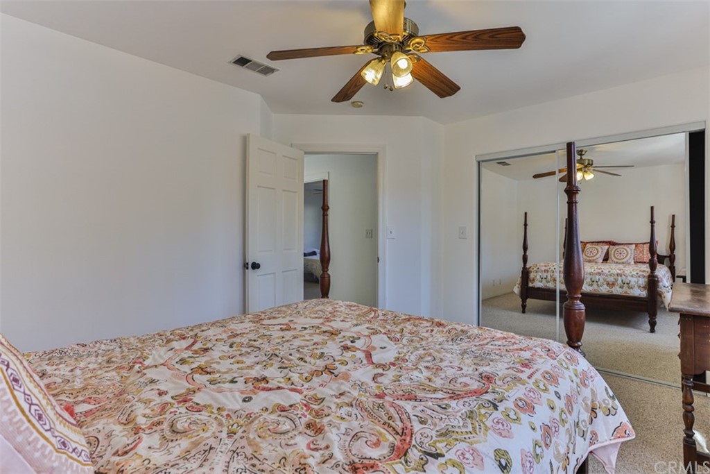 1608 Hill Drive Eagle Rock, CA 90041 - Photo 39 of 71 a bedroom with a large bed and a chandelier