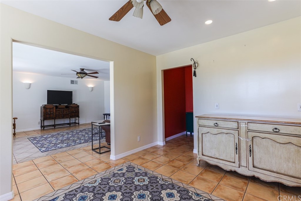 1608 Hill Drive Eagle Rock, CA 90041 - Photo 48 of 71 a kitchen with stainless steel appliances kitchen island granite countertop a refrigerator a stove a microwave oven with white cabinets and wooden floor