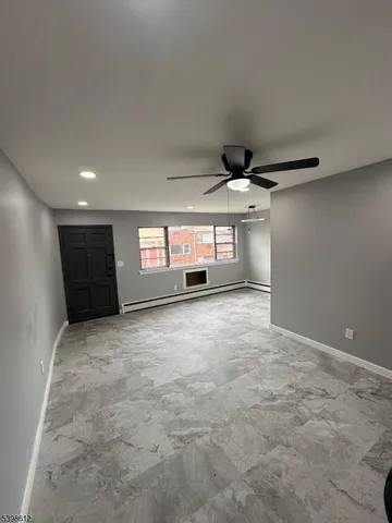 a kitchen with granite countertop a sink stainless steel appliances and cabinets