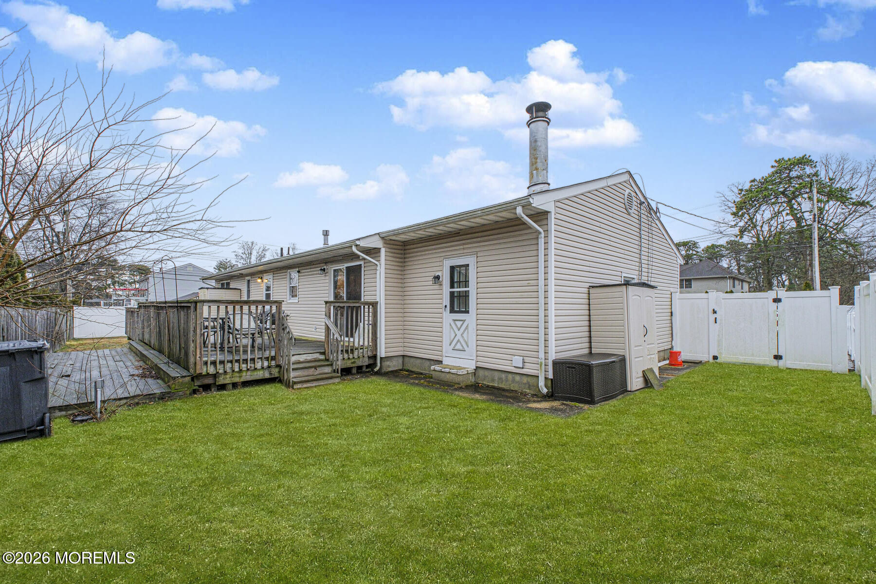 a view of a house with a yard and porch