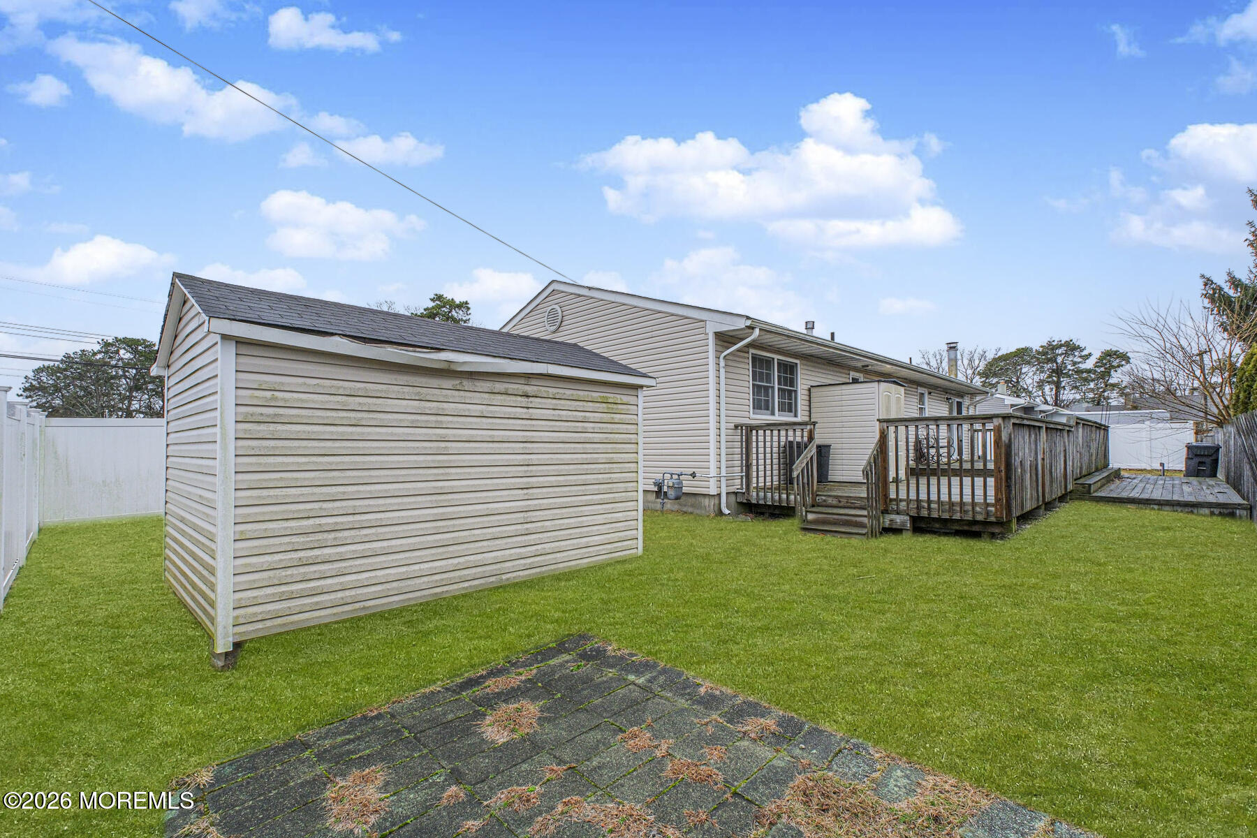 237 Pine Tree Drive Brick, NJ 08723 - Photo 23 of 24 a view of a backyard with a garden