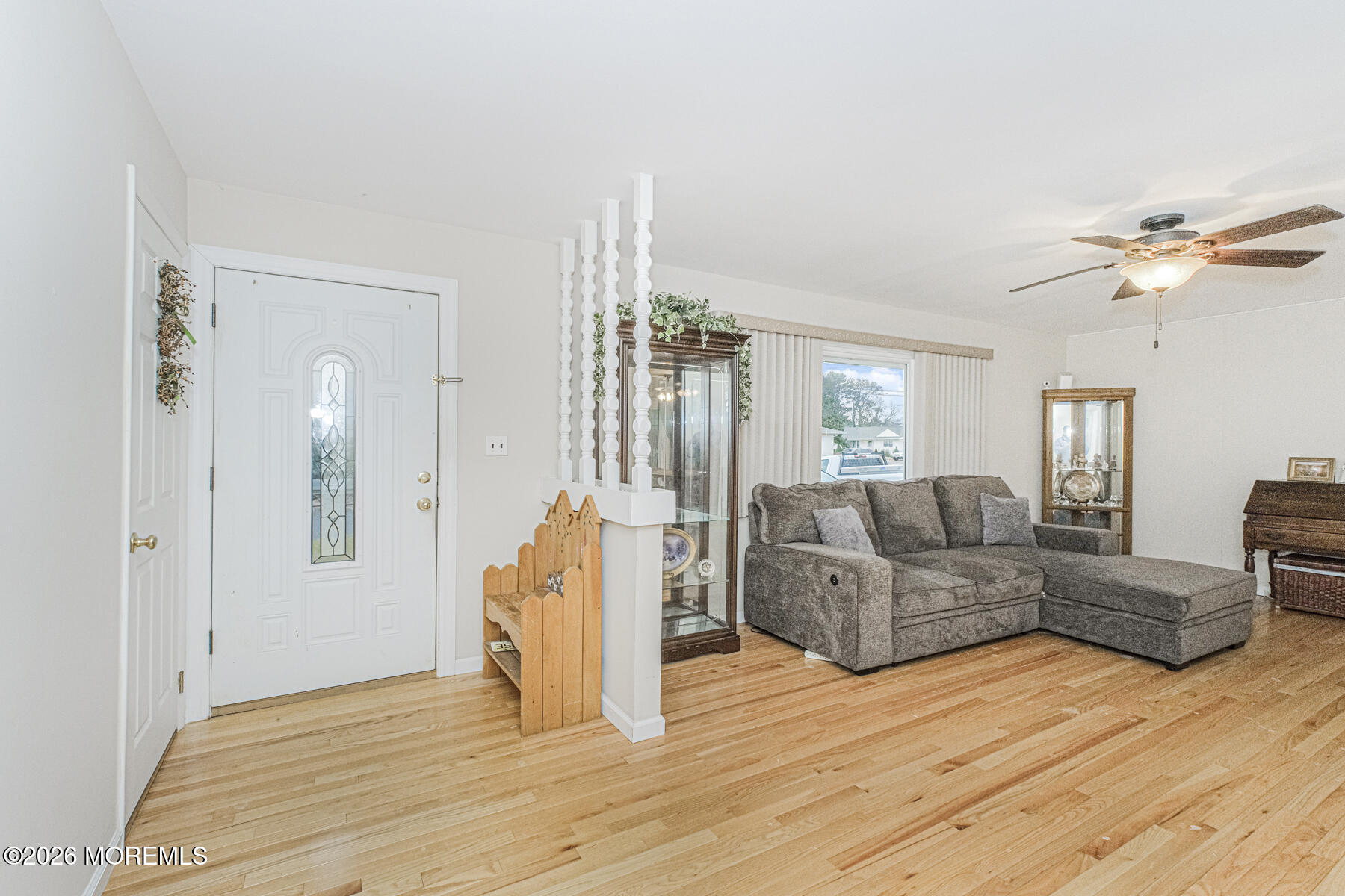 237 Pine Tree Drive Brick, NJ 08723 - Photo 5 of 24 a living room with furniture and a wooden floor