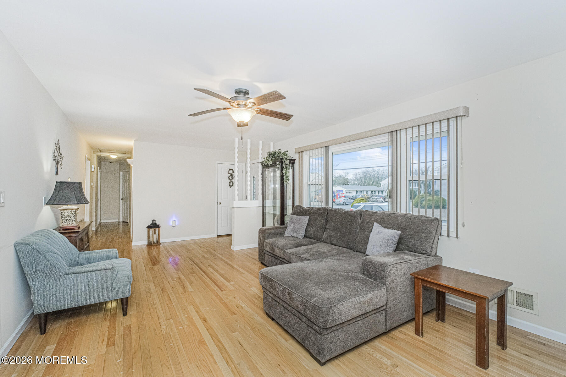 237 Pine Tree Drive Brick, NJ 08723 - Photo 7 of 24 a living room with furniture and a large window