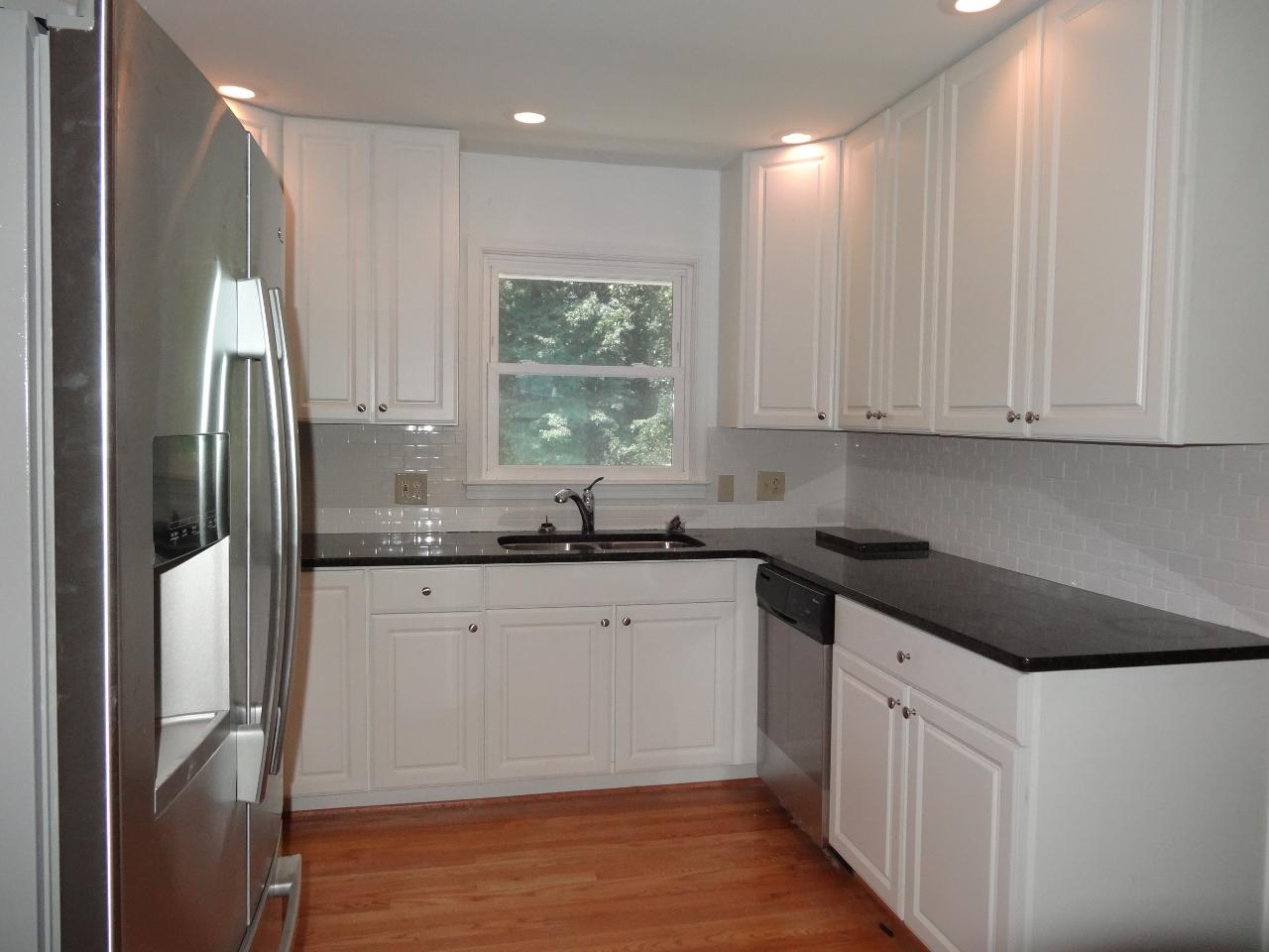 12895 Hardy Road Hardy, VA 24101 - Photo 2 of 15 a kitchen with stainless steel appliances granite countertop a refrigerator sink and cabinets