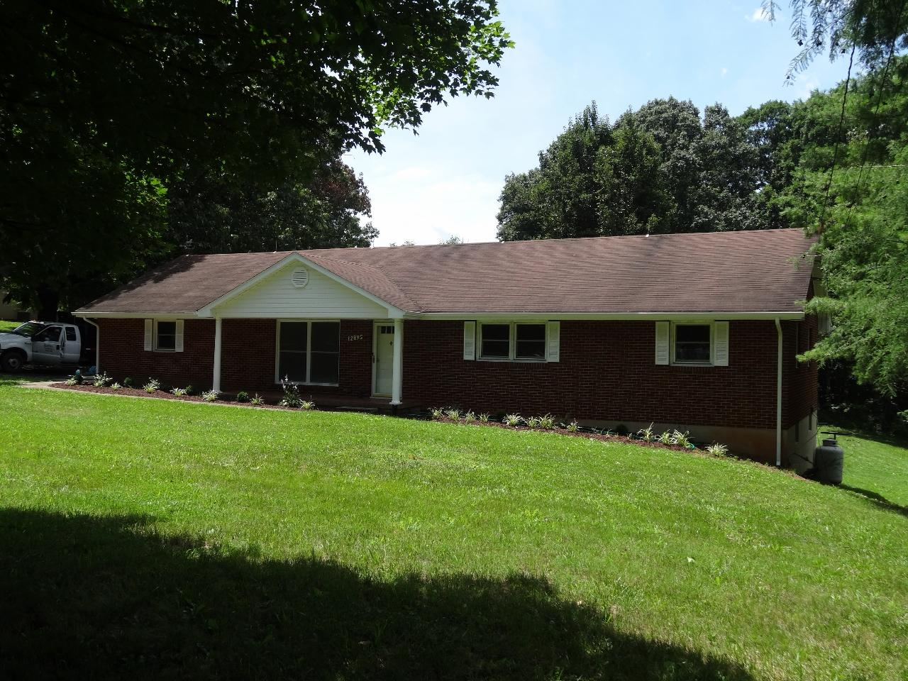 12895 Hardy Road Hardy, VA 24101 - Photo 13 of 15 a front view of a house with a garden