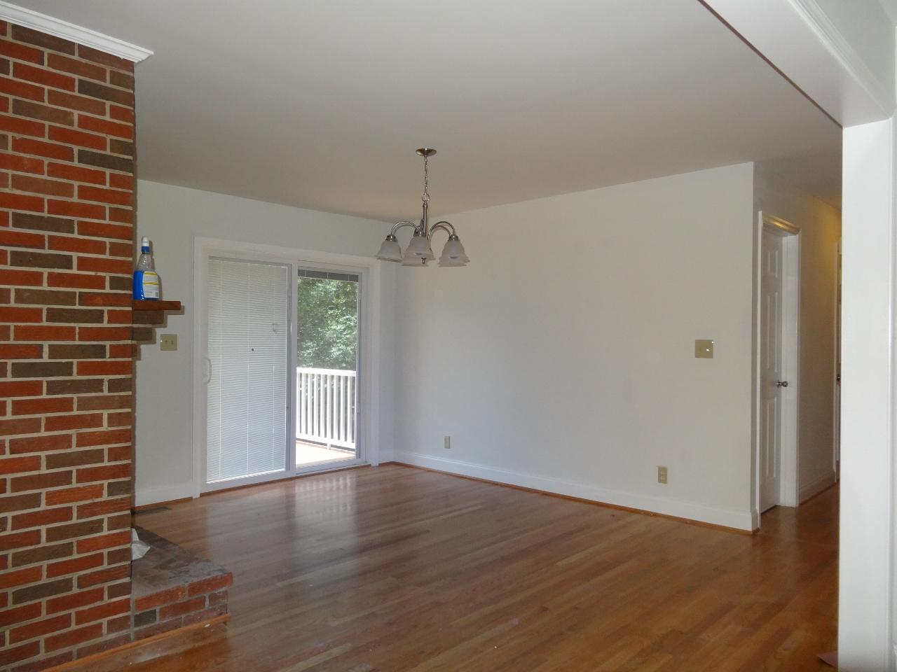 12895 Hardy Road Hardy, VA 24101 - Photo 5 of 15 a view of an empty room with wooden floor and a window