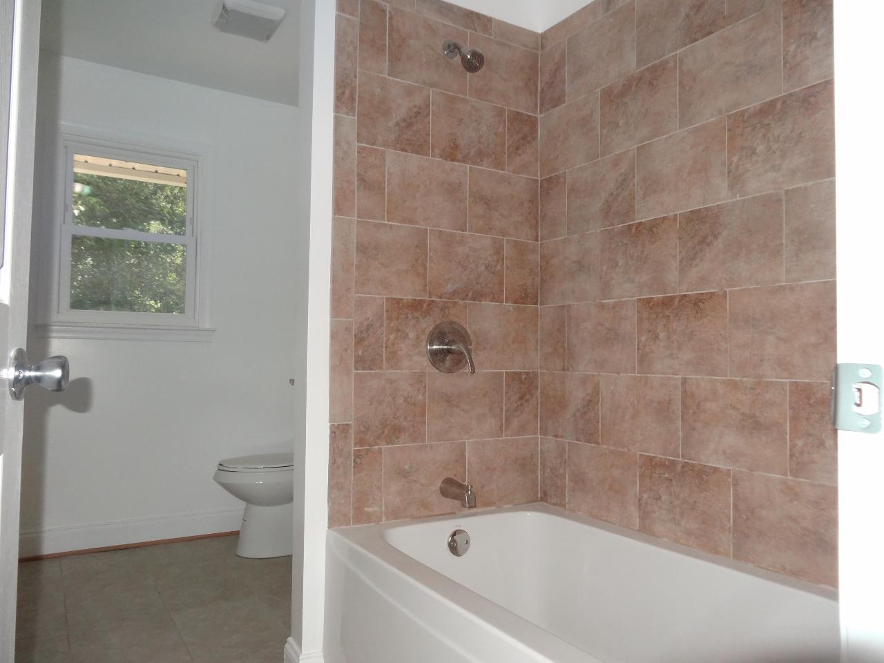 12895 Hardy Road Hardy, VA 24101 - Photo 7 of 15 a bathroom with a bathtub and a toilet