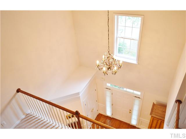 3723 Old Post Road Raleigh, NC 27612 - Photo 18 of 25 Here is a view of the foyer showing all the beautiful light that enters the front of this home. The chandelier casts a beautiful dappled light on the walls. Foyer