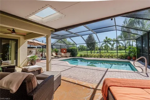 a view of a patio with a table chairs and a patio