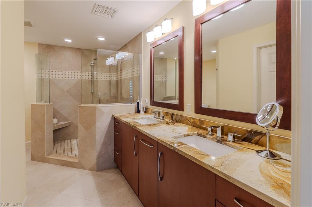 11737 Quail Village Way Naples, FL 34119 - Photo 18 of 50 a bathroom with a granite countertop sink mirror and double