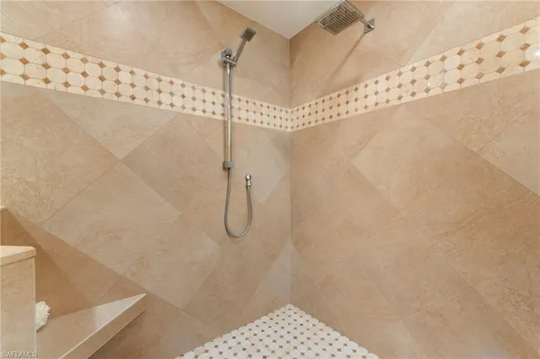 a bathroom with a granite countertop sink mirror and double
