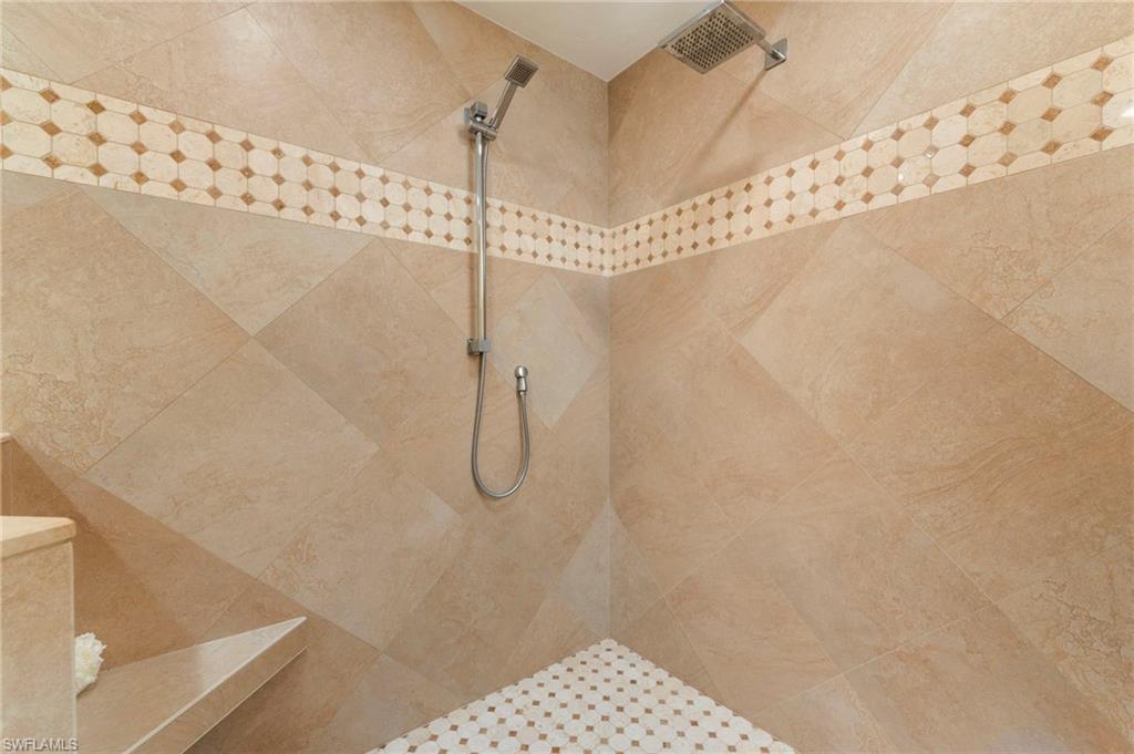 11737 Quail Village Way Naples, FL 34119 - Photo 19 of 50 a bathroom with a shower