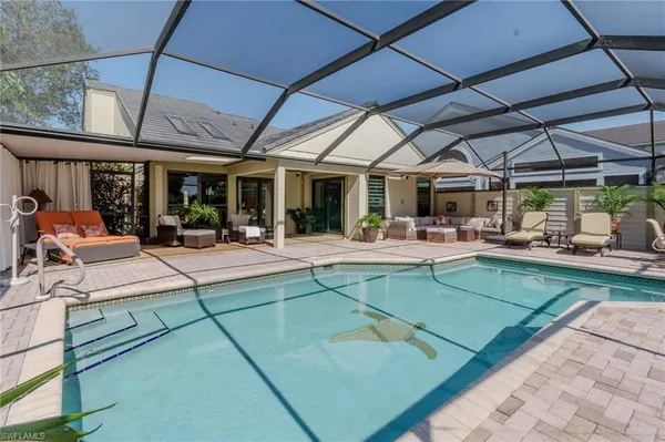 a view of a patio with a table and chairs