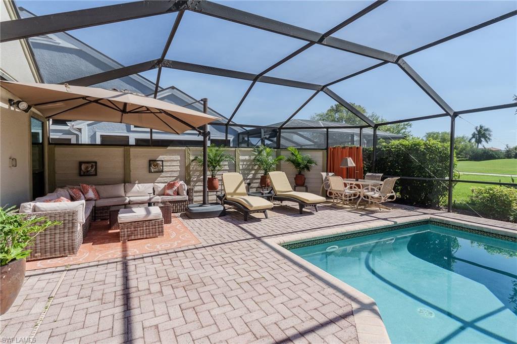 11737 Quail Village Way Naples, FL 34119 - Photo 30 of 50 a view of a backyard with sitting area