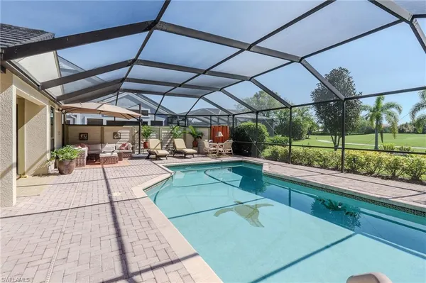 a view of a backyard with sitting area
