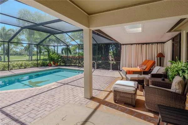 a view of a backyard with sitting area