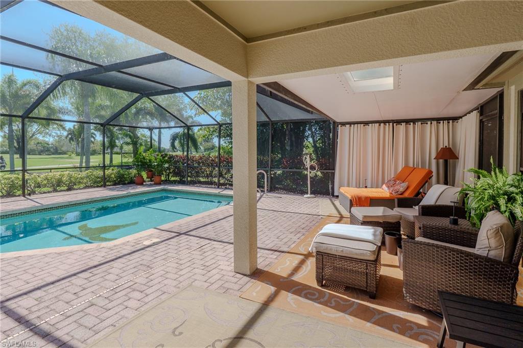 11737 Quail Village Way Naples, FL 34119 - Photo 32 of 50 a garden view with a seating space