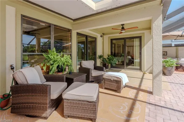 a outdoor space with patio the couches and a chair with the garden view