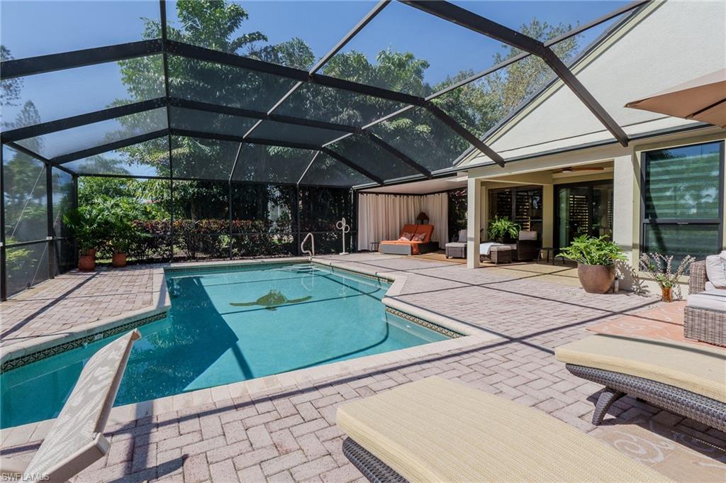 11737 Quail Village Way Naples, FL 34119 - Photo 35 of 50 a view of a backyard with sitting area