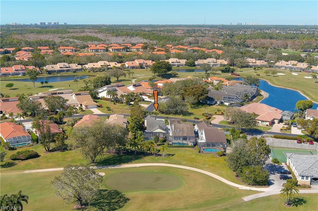 11737 Quail Village Way Naples, FL 34119 - Photo 40 of 50 an aerial view of residential houses with outdoor space and lake view