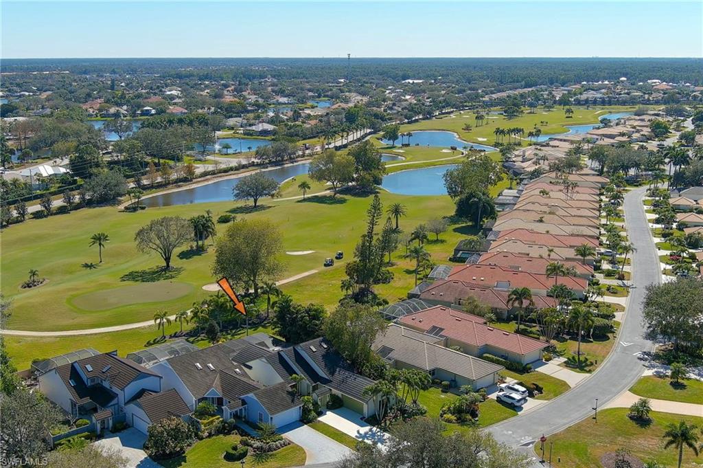 11737 Quail Village Way Naples, FL 34119 - Photo 41 of 50 an aerial view of a city with lots of residential buildings ocean and mountain view in back