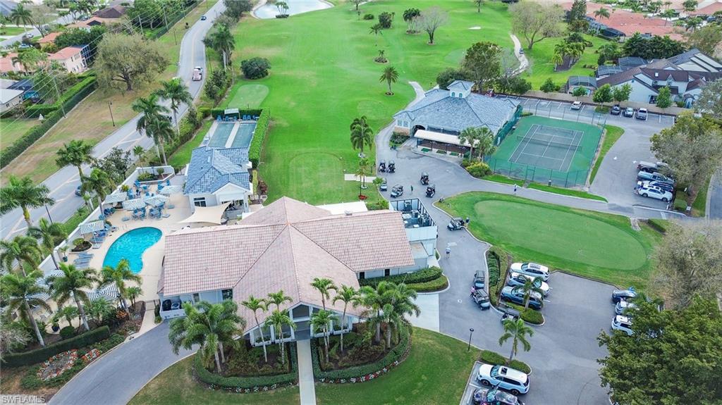 11737 Quail Village Way Naples, FL 34119 - Photo 49 of 50 an aerial view of a house with a yard and lake view