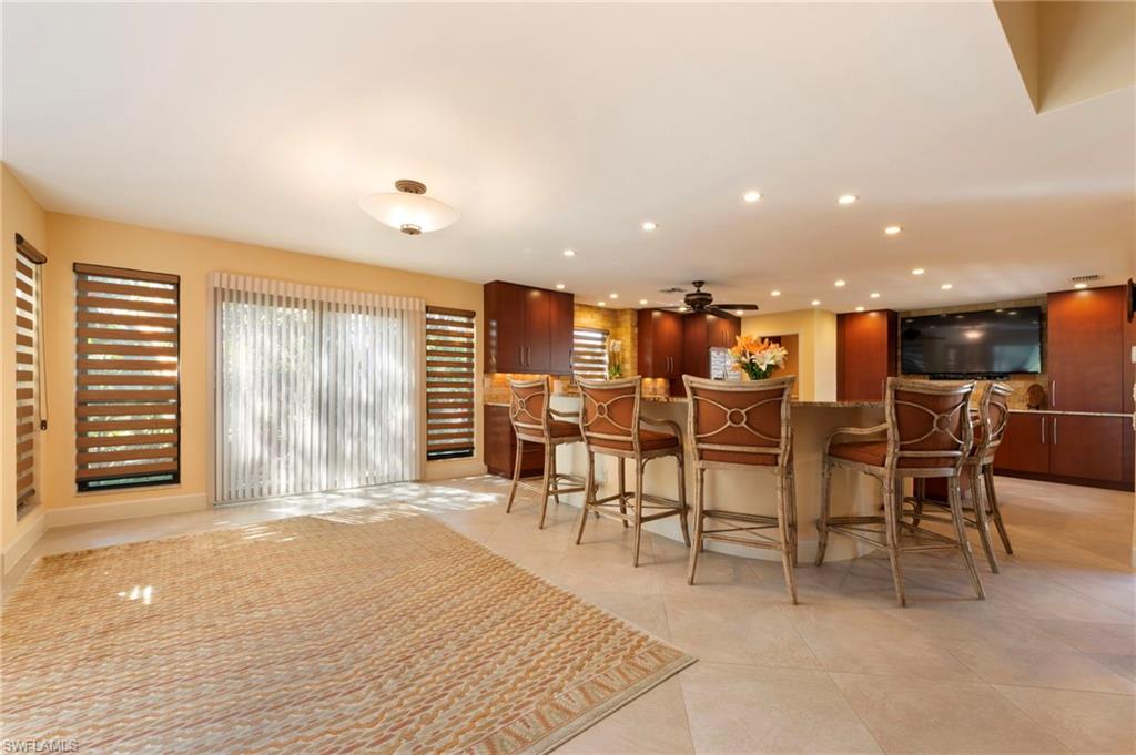 11737 Quail Village Way Naples, FL 34119 - Photo 9 of 50 a view of a dining room with furniture