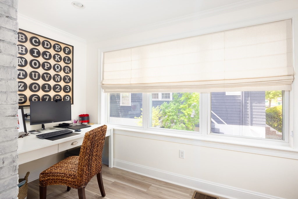 112 Oakdale Road Newton, MA 02461 - Photo 8 of 14 a view of a workspace with furniture and a window