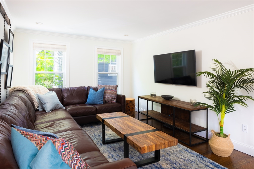 112 Oakdale Road Newton, MA 02461 - Photo 10 of 14 a living room with furniture and a flat screen tv