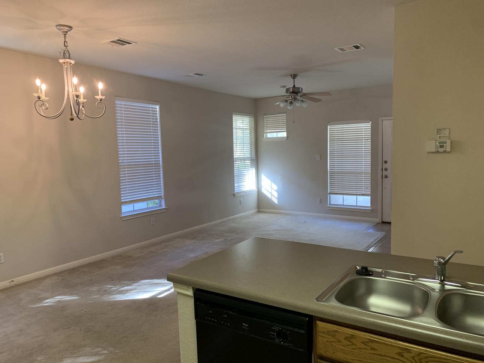 11000 Anderson Mill Road, Unit 29 Austin, TX 78750 - Photo 27 of 27 a kitchen with a sink cabinets and window