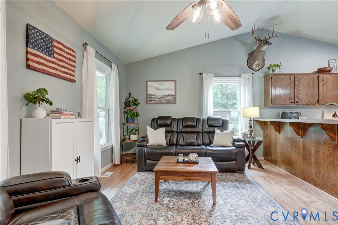 6716 Church Road Petersburg, VA 23803 - Photo 12 of 44 a living room with furniture and wooden floor