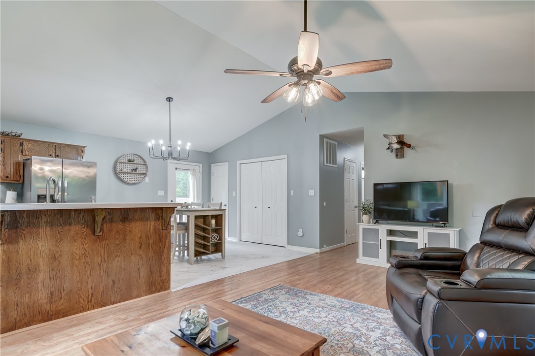 6716 Church Road Petersburg, VA 23803 - Photo 13 of 44 a living room with furniture and a flat screen tv