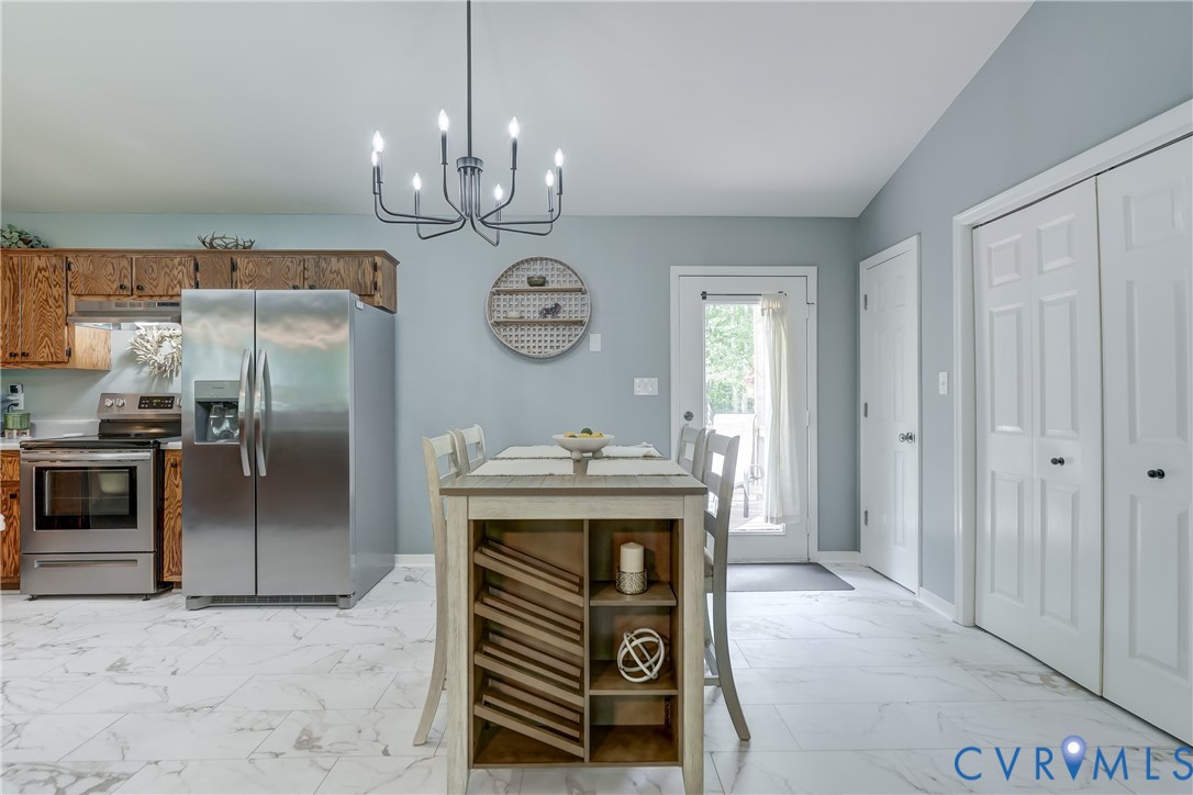 6716 Church Road Petersburg, VA 23803 - Photo 14 of 44 New floor in kitchen with stainless appliances