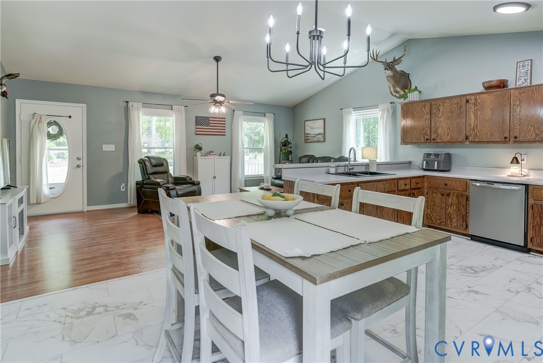 6716 Church Road Petersburg, VA 23803 - Photo 44 of 44 a kitchen with a table chairs stove and cabinets