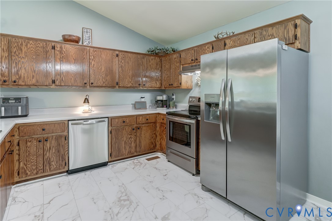6716 Church Road Petersburg, VA 23803 - Photo 17 of 44 a kitchen with a sink stainless steel appliances and cabinets