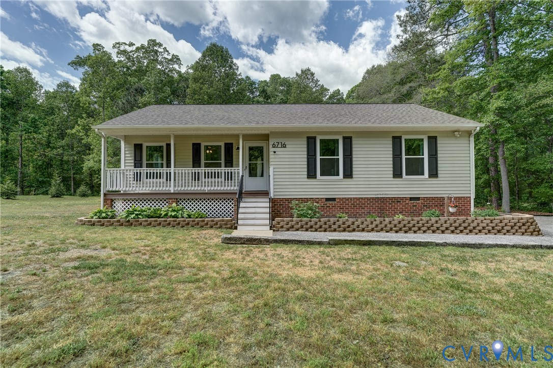 6716 Church Road Petersburg, VA 23803 - Photo 2 of 44 a front view of a house with a garden